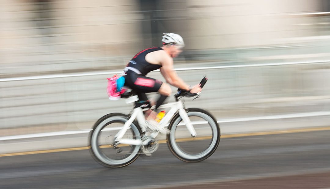 blurry triathlete on triathlon bike