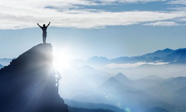 climbing to top of mountain