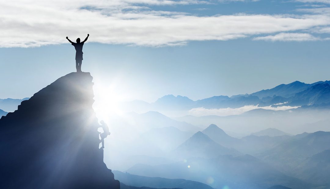 climbing to top of mountain