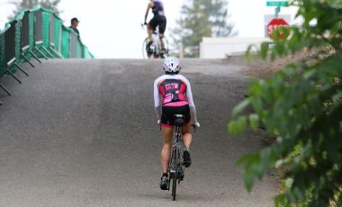 krista climbing on bike vineman