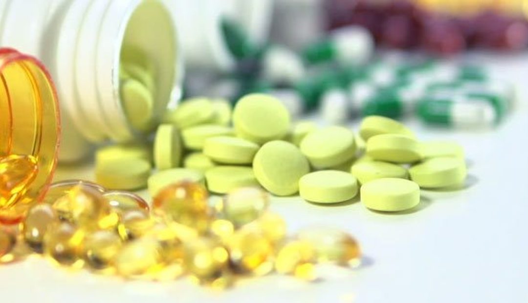 pills spilling out of pill bottle