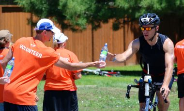 triathlete at aid station